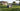 AI robot lawn mower with intelligent vision navigation maintaining a healthy residential lawn